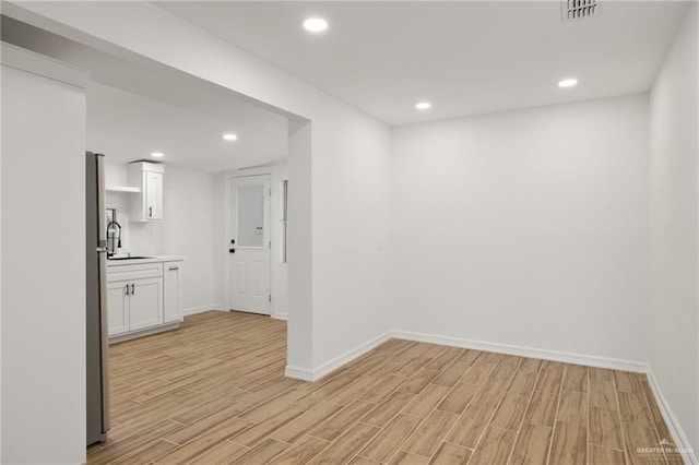 interior space with sink and light wood-type flooring