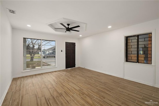 spare room with ceiling fan and light hardwood / wood-style flooring