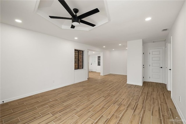 empty room featuring light hardwood / wood-style flooring and ceiling fan