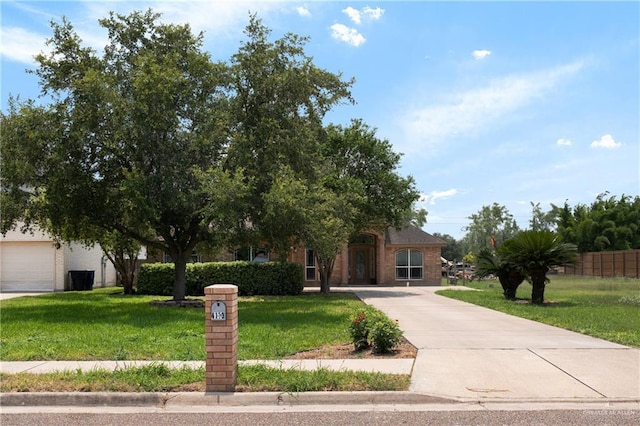 4113 Ulex Ave, Mcallen, TX 78504 - view of property hidden behind natural elements featuring a front lawn and driveway