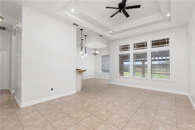 4113 Ulex Ave, Mcallen, TX 78504 - unfurnished living room with a raised ceiling, a ceiling fan, a chandelier, light tile patterned floors, and recessed lighting