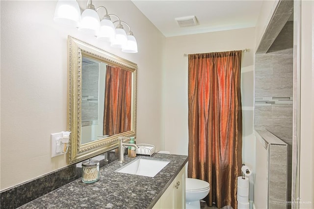 bathroom with vanity and toilet