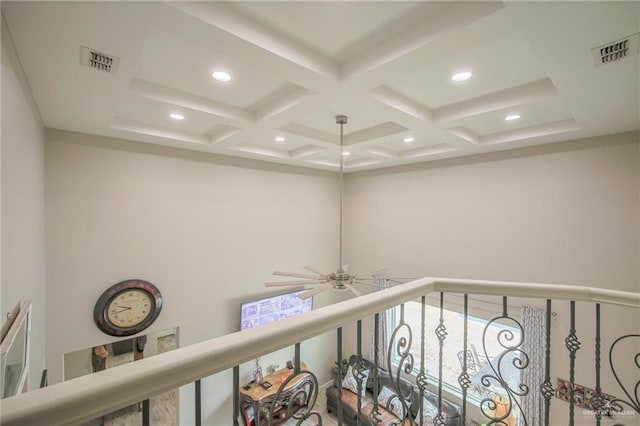 hall featuring beamed ceiling and coffered ceiling