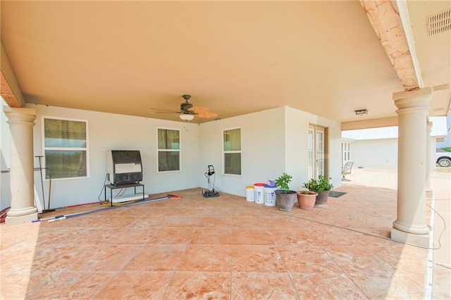 view of patio featuring ceiling fan