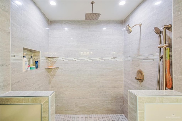 bathroom with tiled shower