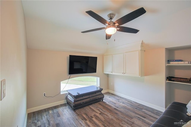 unfurnished living room featuring dark hardwood / wood-style floors, ceiling fan, and lofted ceiling