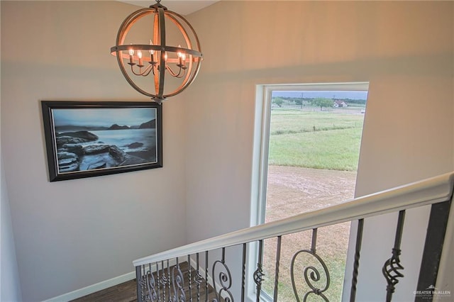 interior space with hardwood / wood-style floors and a notable chandelier