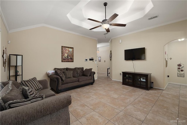 living room featuring arched walkways, visible vents, crown molding, and ceiling fan