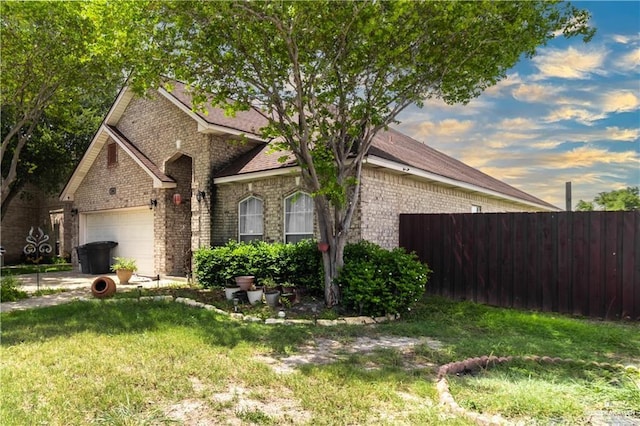 view of front of house with a lawn and a garage