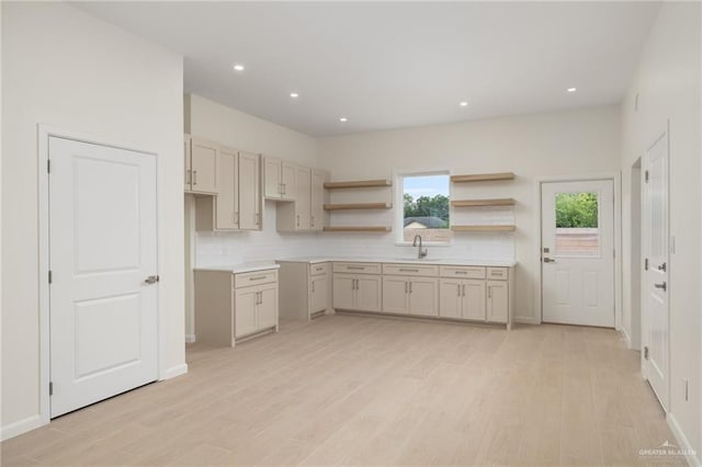 1200 N Lincoln Ave, San Juan, TX 78589 - kitchen with a sink, backsplash, light wood-type flooring, plenty of natural light, and recessed lighting