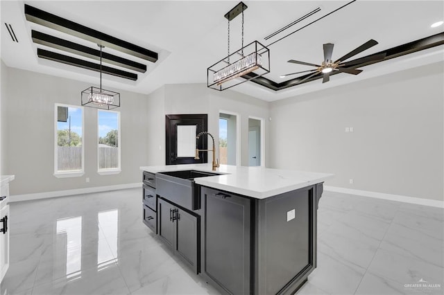 2313 Blue Sky Dr, Weslaco, TX 78599 - kitchen featuring a raised ceiling, light marble finish flooring, healthy amount of natural light, and pendant lighting
