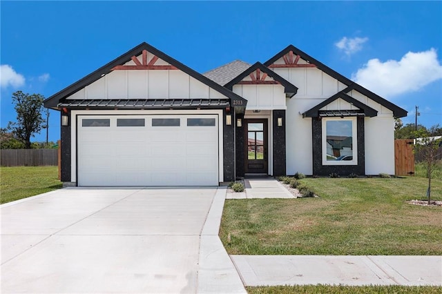 2313 Blue Sky Dr, Weslaco, TX 78599 - view of front facade with board and batten siding, driveway, and an attached garage