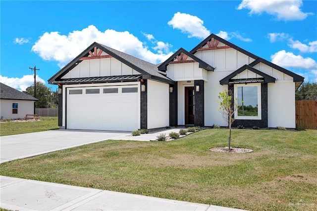 2313 Blue Sky Dr, Weslaco, TX 78599 - view of front of property with board and batten siding, an attached garage, concrete driveway, and a standing seam roof