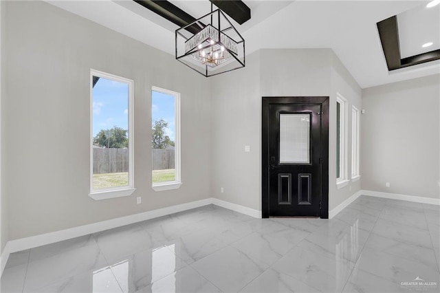 2313 Blue Sky Dr, Weslaco, TX 78599 - foyer entrance with a chandelier and light marble finish floors