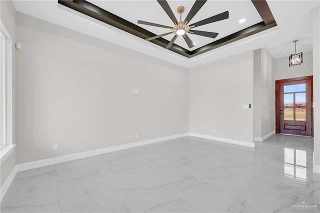 2313 Blue Sky Dr, Weslaco, TX 78599 - unfurnished room featuring a raised ceiling, light marble finish flooring, ceiling fan, and recessed lighting