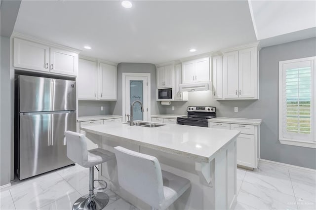 kitchen with white cabinets, sink, and appliances with stainless steel finishes