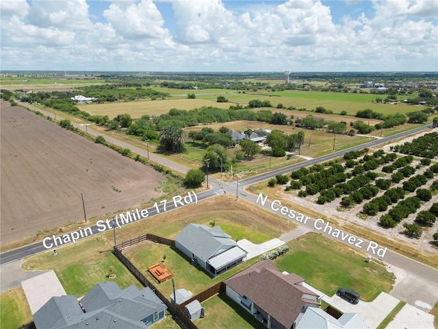 birds eye view of property with a rural view