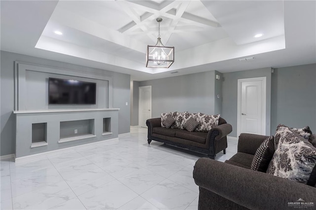 living room featuring an inviting chandelier, a raised ceiling, built in features, and coffered ceiling