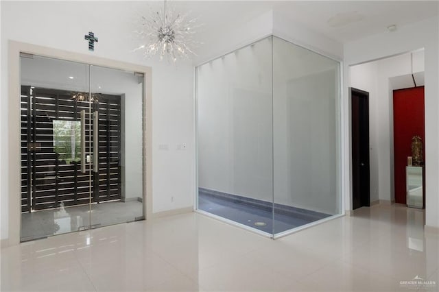 wine cellar featuring an inviting chandelier and tile patterned flooring