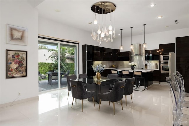 dining area featuring light tile patterned floors and a chandelier