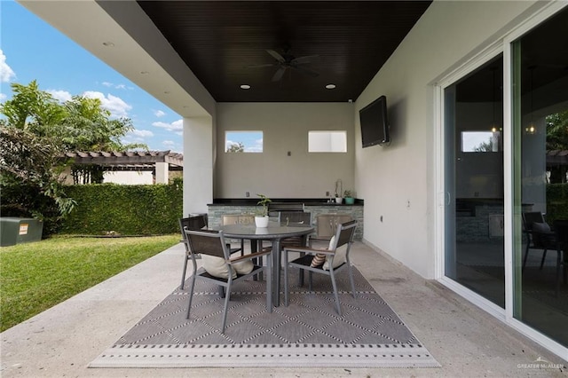 view of patio / terrace with area for grilling, sink, and ceiling fan