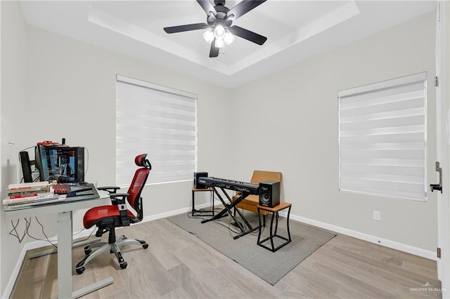 1409 E Danielle Ave E, Pharr, TX 78577 - office featuring baseboards, a ceiling fan, a raised ceiling, and wood finished floors