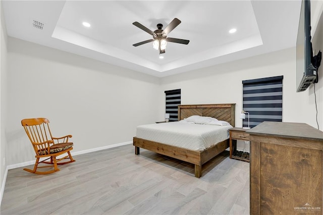 1409 E Danielle Ave E, Pharr, TX 78577 - bedroom with visible vents, recessed lighting, a raised ceiling, and light wood-type flooring