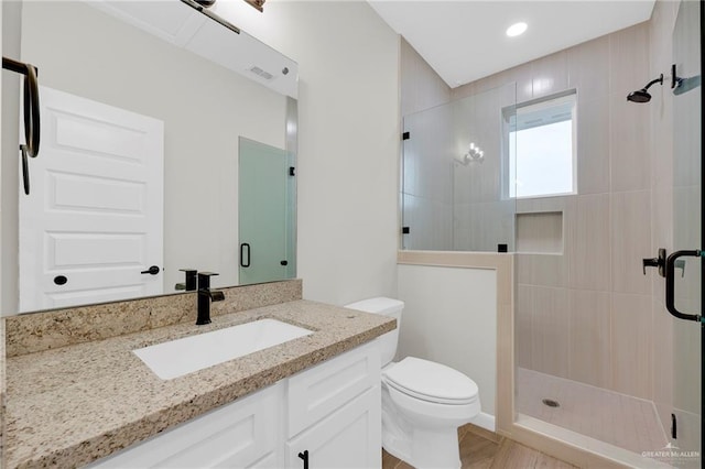 1409 E Danielle Ave E, Pharr, TX 78577 - full bathroom featuring vanity, a stall shower, toilet, and visible vents