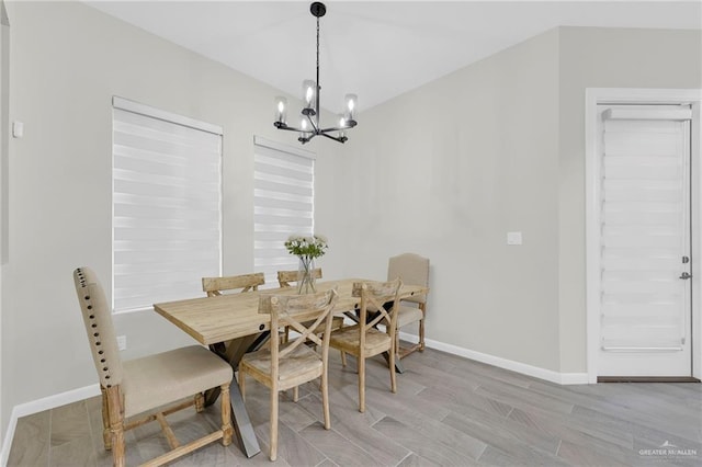1409 E Danielle Ave E, Pharr, TX 78577 - dining space featuring baseboards, a chandelier, and light wood-type flooring