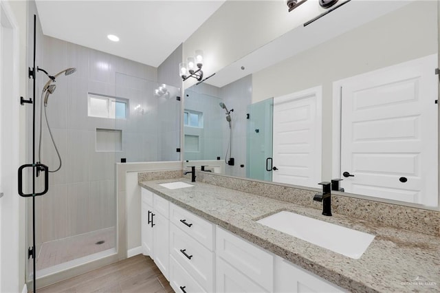 1409 E Danielle Ave E, Pharr, TX 78577 - full bath with double vanity, recessed lighting, a shower stall, and a sink