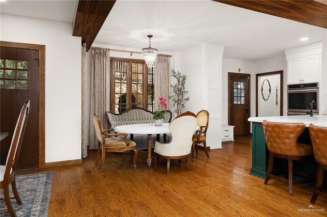 707 N 15th St, Mcallen, TX 78501 - dining space with a chandelier, plenty of natural light, wood finished floors, and recessed lighting