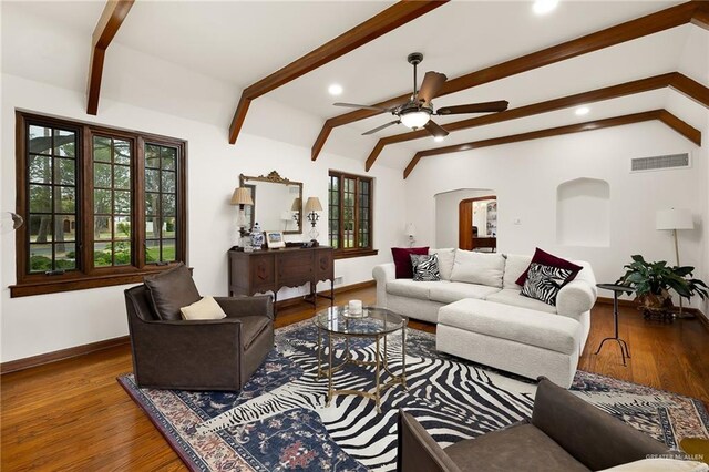 707 N 15th St, Mcallen, TX 78501 - living room with healthy amount of natural light, ceiling fan, arched walkways, wood finished floors, and recessed lighting