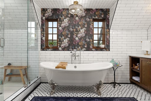 707 N 15th St, Mcallen, TX 78501 - full bathroom with a stall shower, vanity, wallpapered walls, a soaking tub, and tile walls