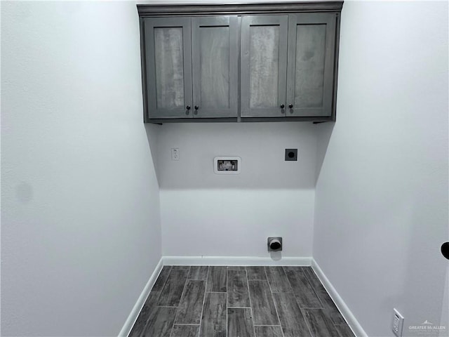 washroom featuring dark wood finished floors, baseboards, electric dryer hookup, and hookup for a washing machine
