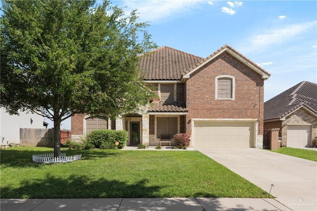 view of front of property featuring a garage and a front lawn