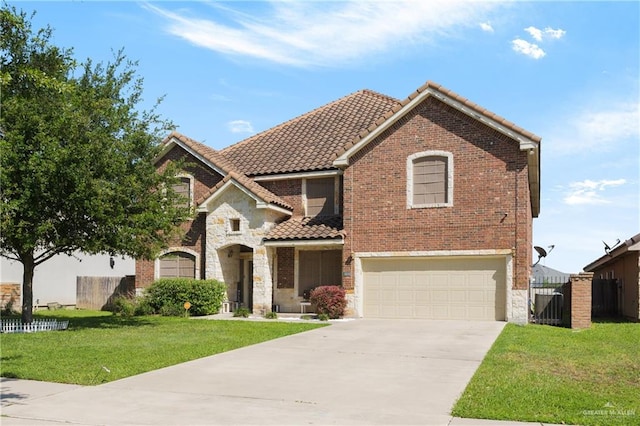 view of front of home with a garage and a front lawn