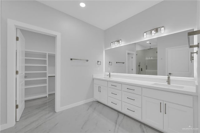 bathroom with vanity and a shower with shower door