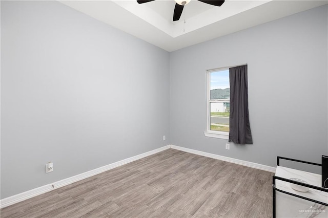 1012 Cooper Ln, San Juan, TX 78589 - unfurnished room featuring light wood-style flooring, ceiling fan, and baseboards