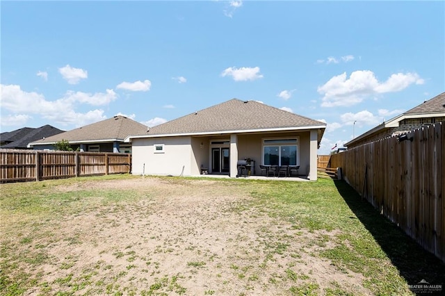 1012 Cooper Ln, San Juan, TX 78589 - rear view of property featuring stucco siding and a patio area