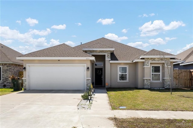 1012 Cooper Ln, San Juan, TX 78589 - view of front of home with stone siding, a garage, and stucco siding