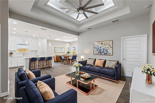 2200 Zinnia St, Weslaco, TX 78599 - living room with wood finished floors, a raised ceiling, ceiling fan, and recessed lighting