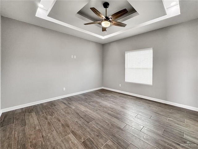 2200 Zinnia St, Weslaco, TX 78599 - spare room with a tray ceiling, wood tiled floors, and ceiling fan