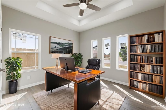2200 Zinnia St, Weslaco, TX 78599 - office with plenty of natural light, ceiling fan, wood finished floors, and a tray ceiling