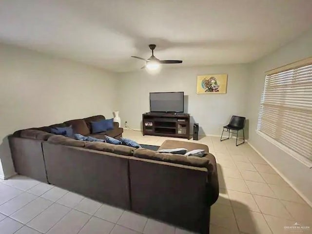 living room featuring ceiling fan and light tile patterned floors