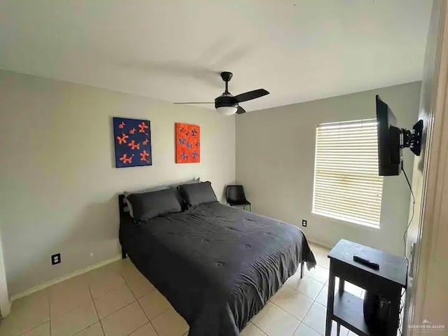 tiled bedroom with ceiling fan