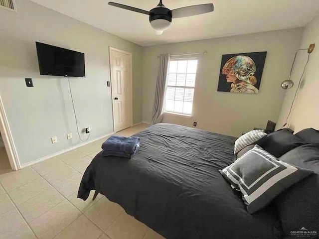 bedroom featuring ceiling fan and light tile patterned floors