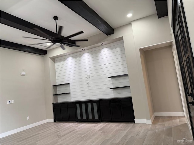 kitchen with ceiling fan, beam ceiling, and light hardwood / wood-style flooring