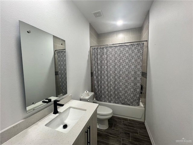 full bathroom featuring vanity, toilet, and shower / bath combo with shower curtain