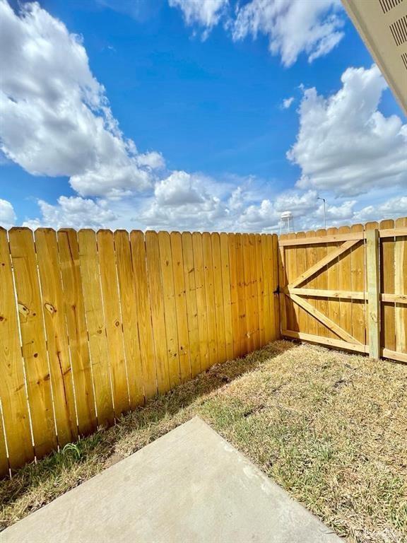 203 W Campeche Ave, Alton, TX 78573 - view of yard featuring a gate and fence