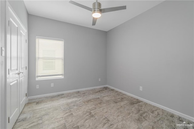 203 W Campeche Ave, Alton, TX 78573 - unfurnished bedroom featuring baseboards, a closet, and a ceiling fan
